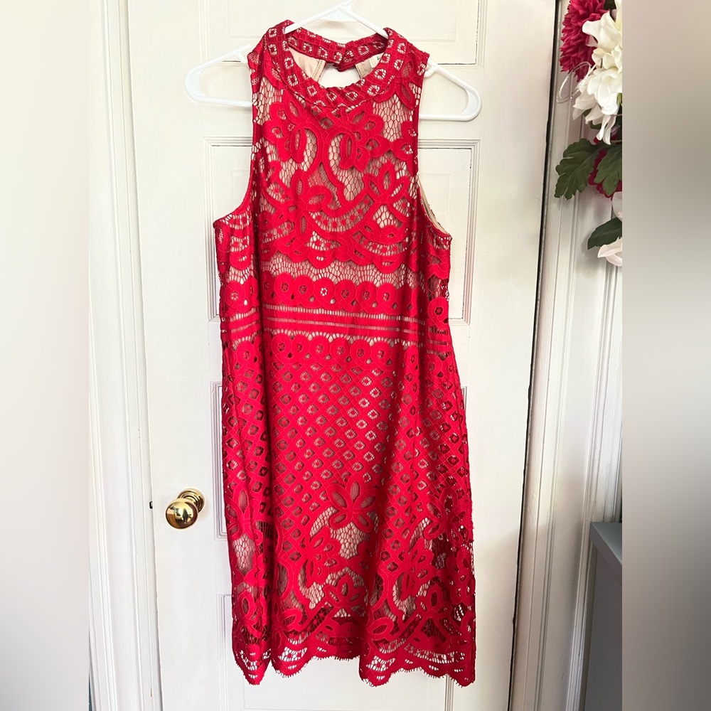 Francesca’s red lace halter neck dress.